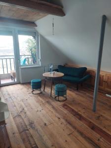 a living room with a table and a couch at Slunce v duši in Dolní Dunajovice