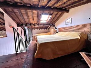 a bedroom with a large bed in a room at Casa Silvia in Lucca