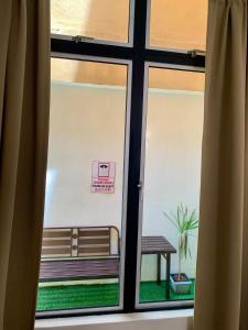a view of a window with a bench outside at Andiana Hotel & Lodge - Kota Bharu City Centre in Kota Bharu