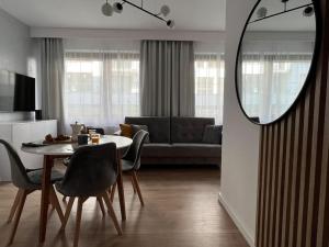 Un televizor și/sau centru de divertisment la Apartament Garnizon