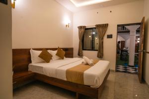 Postel nebo postele na pokoji v ubytování Sapphire Mansion + 22 fotografií