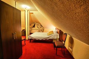 Postel nebo postele na pokoji v ubytování Hotel Zodiak + 37 fotografií