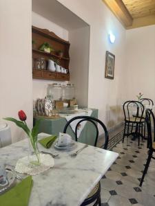 a table with a vase on top of it in a room at Residenza Gonzaga in Serracapriola