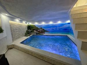 a swimming pool in the middle of a house at Villa By expert VIP in Sarajevo