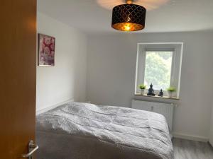 a bedroom with a bed and a window at Rhönluft 1 in Wildflecken