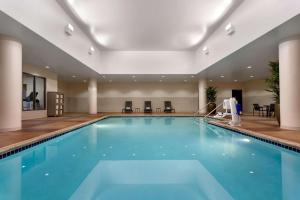 a large swimming pool in a hotel room at Hyatt Place Omaha/Downtown-Old Market in Omaha