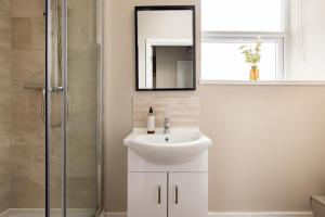 a bathroom with a sink and a shower with a mirror at Charles Hope Plymouth in Plymouth +26 photos