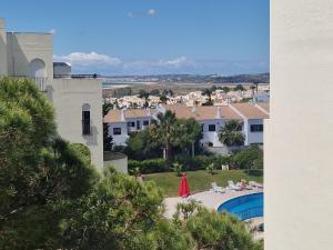 a view of a villa with a swimming pool at T2 Alvor Terrace in Alvor
