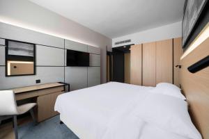 Postel nebo postele na pokoji v ubytování Park Inn by Radisson Makkah Thakher Alsharqi