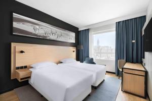 Postel nebo postele na pokoji v ubytování Park Inn by Radisson Makkah Thakher Alsharqi