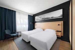 Postel nebo postele na pokoji v ubytování Park Inn by Radisson Makkah Thakher Alsharqi