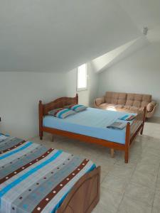 Postel nebo postele na pokoji v ubytování Apartament Timi