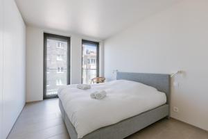 Postel nebo postele na pokoji v ubytování Flat Leon