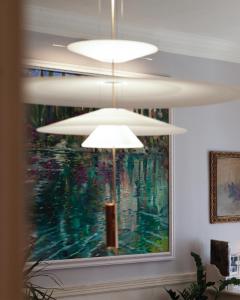 a chandelier in a living room with a painting at Mimi & Coco Old Corfu Town in Corfu