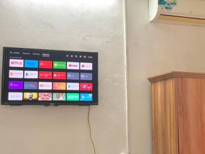 a television hanging on a wall in a room at Friendly room in Hai Phong