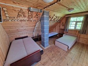 Postel nebo postele na pokoji v ubytování Bajāri - Pirts - Banya