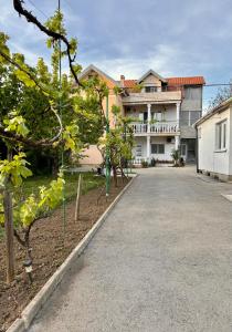 an empty road in front of a house at Bali Apartment in Belgrade