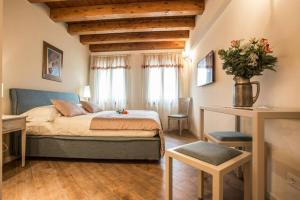 Posteľ alebo postele v izbe v ubytovaní Casa Delneri Boutique Hotel Adults Only