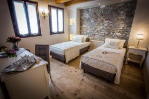 Posteľ alebo postele v izbe v ubytovaní Casa Delneri Boutique Hotel Adults Only
