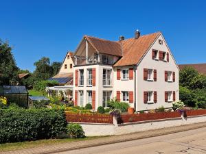 a large house on the side of a street at Ferienwohnung Sauer in Pfofeld