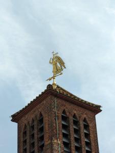 a weather vane on the top of a building at The Shrine of Our Lady of Walsingham in Little Walsingham