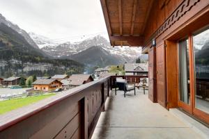 a balcony with a view of a mountain at Penthouse With Sunny Balcony And Sauna in Champéry