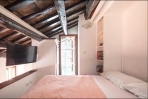 En eller flere senge i et værelse på Accogliente casa al Pantheon