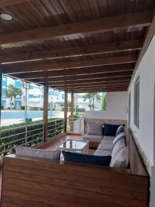 a patio with a couch and a table at Appartement de Luxe Arena Martil in Martil