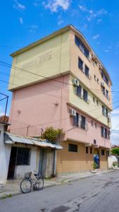 a building with a bike parked in front of it at The Galley Party Hostel in Shkodër