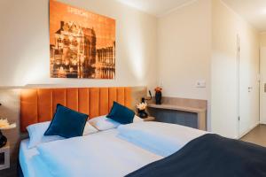 Postel nebo postele na pokoji v ubytování MYKY Aparthotel Harburg - Free Parking