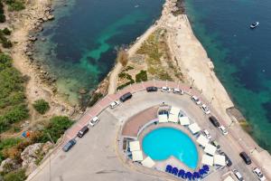 an aerial view of a amphitheater next to the water at Ambassador Hotel in St Paul's Bay