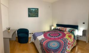 a bedroom with a bed and a desk and a chair at Apartment in Trastevere Porta Portese in Rome