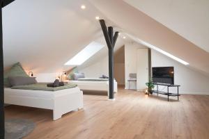 TV a/nebo společenská místnost v ubytování Juno Living - Witten Apartmenthaus