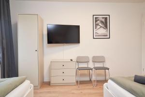 TV a/nebo společenská místnost v ubytování Juno Living - Witten Apartmenthaus
