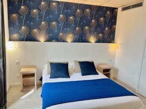 Voodi või voodid majutusasutuse Hôtel de Flore toas