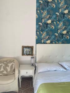 a bedroom with a bed and a couch and a table at Al B6 CLOSE TO VENICE in Mogliano Veneto