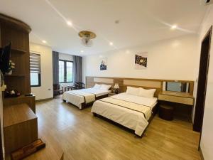 Postel nebo postele na pokoji v ubytování Thien Hai Hotel
