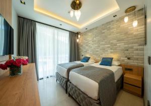 Postel nebo postele na pokoji v ubytování Batıhan Vadi Hotel