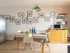 a dining room with a table and chairs at Apartment Il Poggio by Interhome in Letojanni