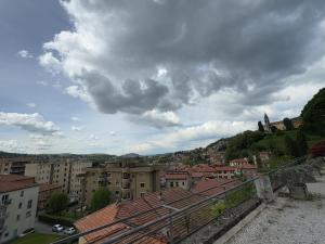 a view of a city with buildings and a cloudy sky at Residence Rossini in Tavernerio
