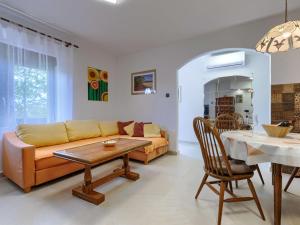 a living room with a couch and a table at Holiday Home Lancin - RCA452 by Interhome in Marčana