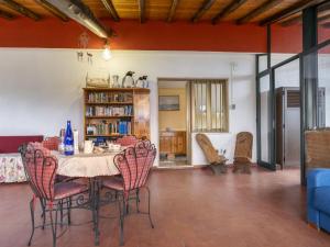 a dining room with a table and chairs at Apartment Serena by Interhome in Piedimonte Etneo