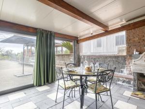 a dining room with a table and chairs at Studio Serena by Interhome in Piedimonte Etneo