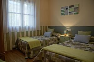 Posteľ alebo postele v izbe v ubytovaní Apartaments El Ribal