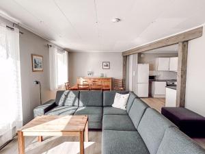 a living room with a couch and a table at Holiday Home Tantestova - FJS296 by Interhome in Balestrand