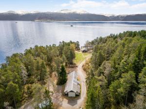 an aerial view of a house on the shore of a lake at Holiday Home Veganeset I - FJS294 by Interhome in Balestrand