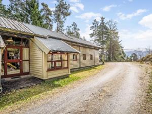 a house on the side of a dirt road at Holiday Home Veganeset I - FJS294 by Interhome in Balestrand