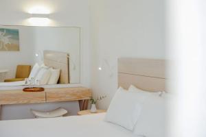 a bedroom with a large mirror and a bed at Nissi Park Hotel in Ayia Napa