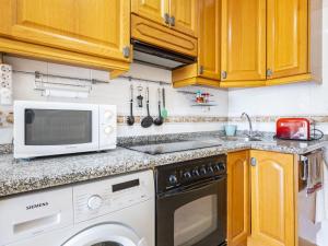 A kitchen or kitchenette at Apartment Grimaca-2 by Interhome