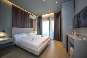 Postel nebo postele na pokoji v ubytování Lake View Rooms Ksamil